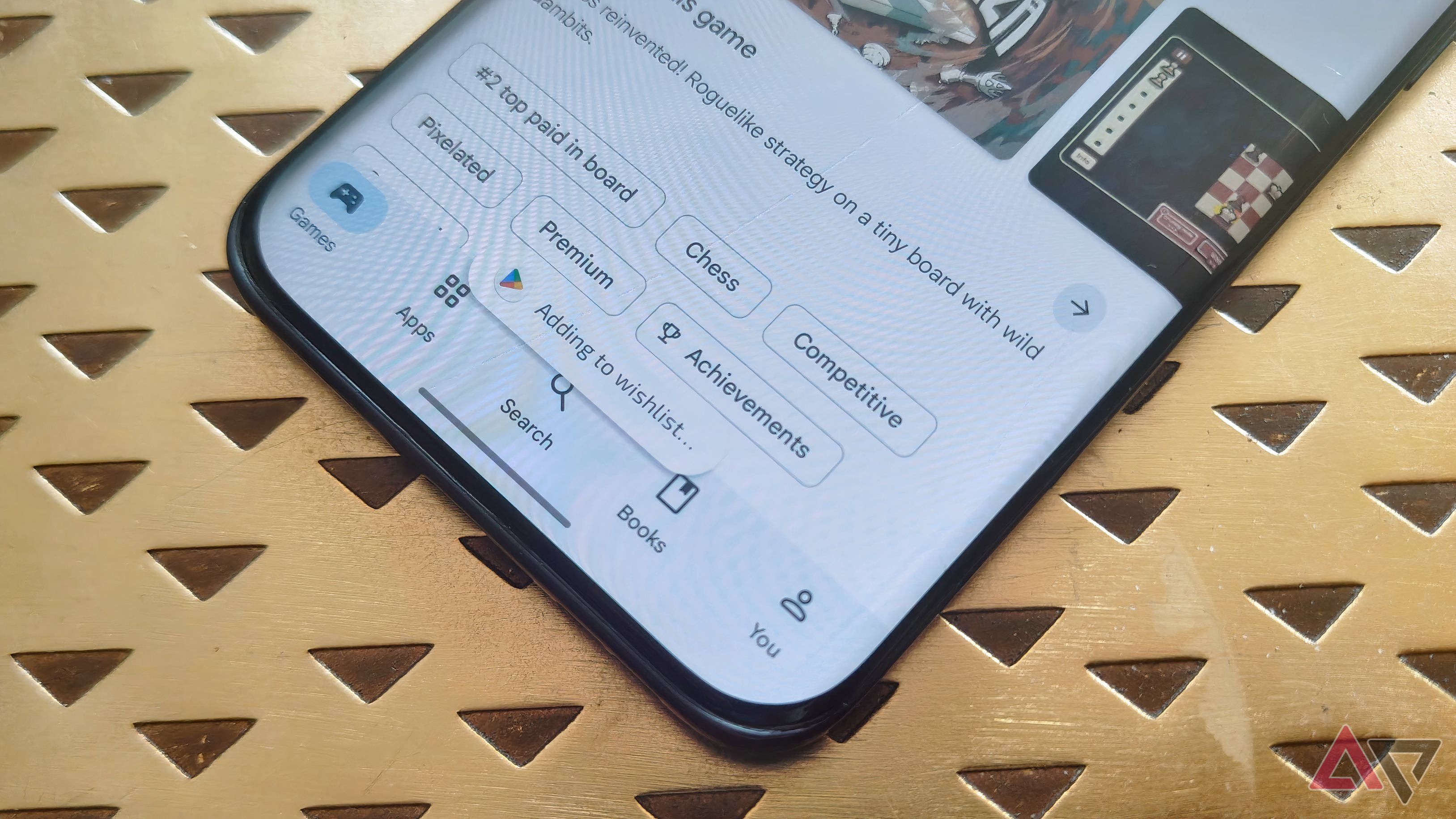 A pop-up on the Google Play Store saying 'Added to wishlist...'
