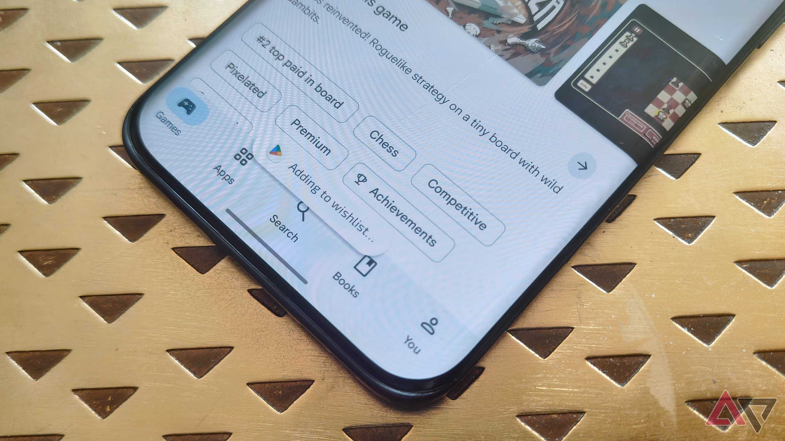 A pop-up on the Google Play Store saying 'Added to wishlist...'