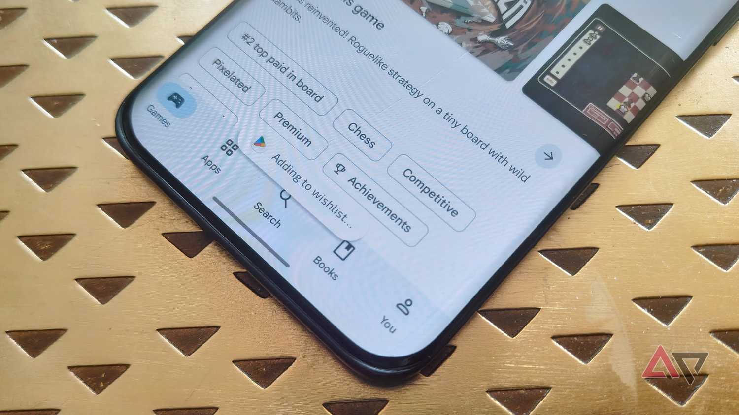 A pop-up on the Google Play Store saying 'Added to wishlist...'