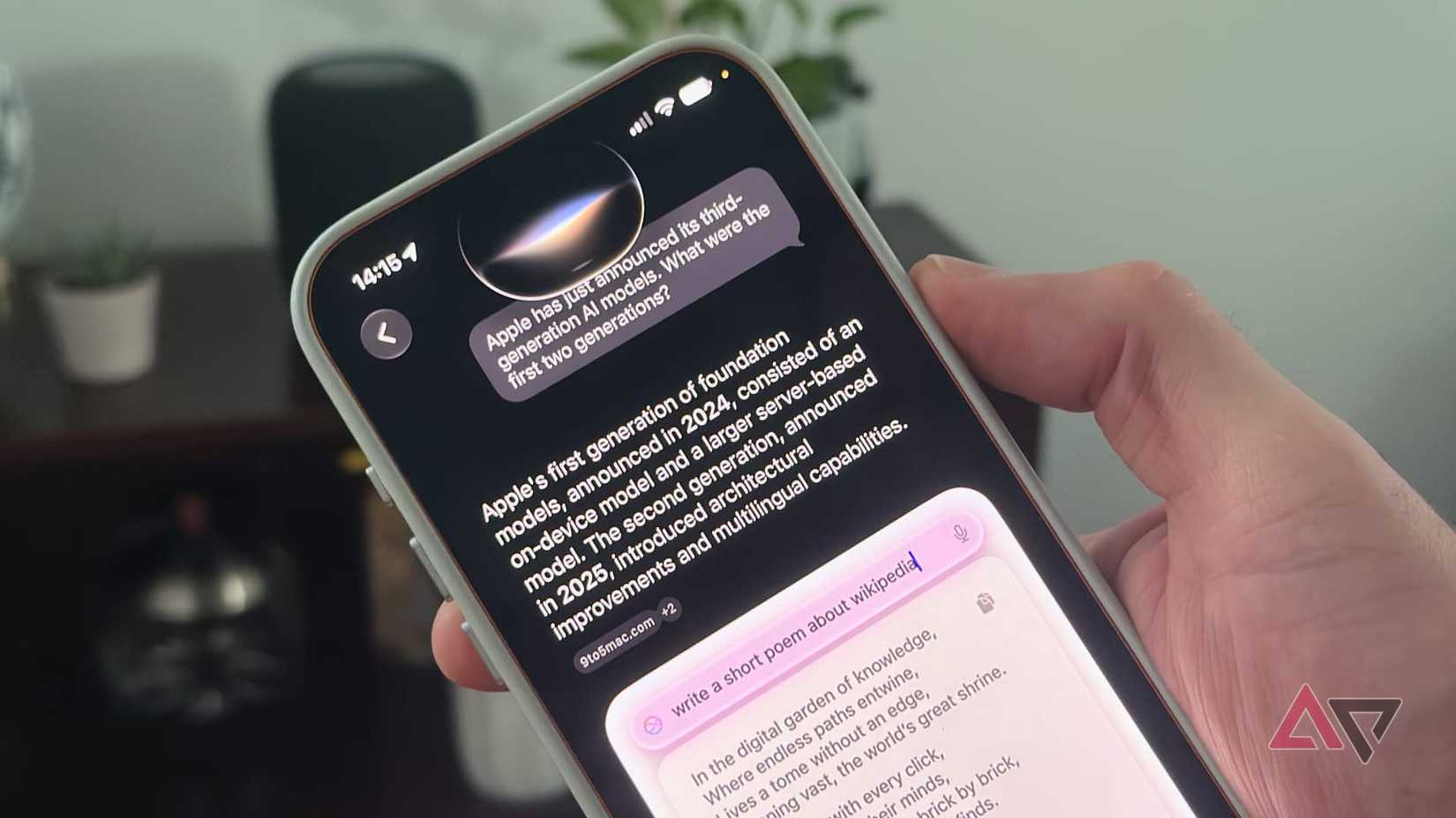Personal holding iPhone 17 Pro Max showing new Siri AI app in iOS 27