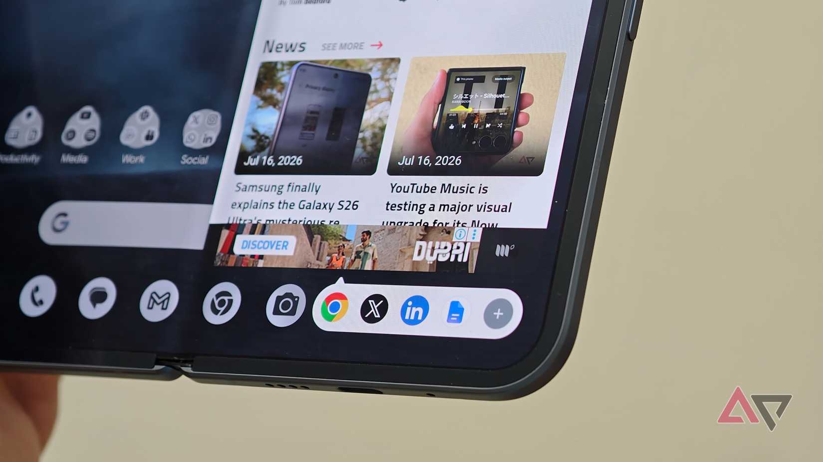 Close-up of the bottom taskbar on a foldable smartphone inner display showing recently used app icons including Chrome, X, and LinkedIn