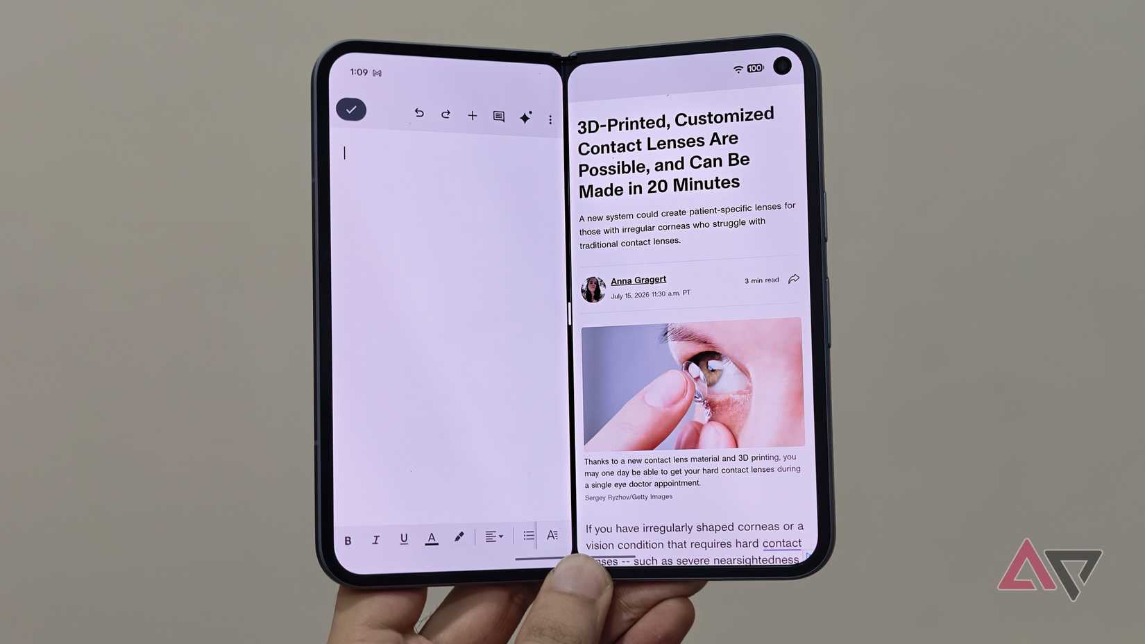 Real-world split-screen multitasking on the Google Pixel Fold showing simultaneous text editing and web article reading