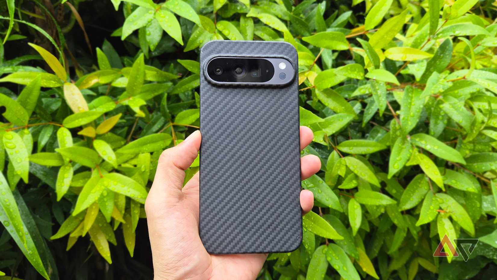 Google Pixel 9 Pro XL with its back on a fiber carbon case and its three camera lenses shown