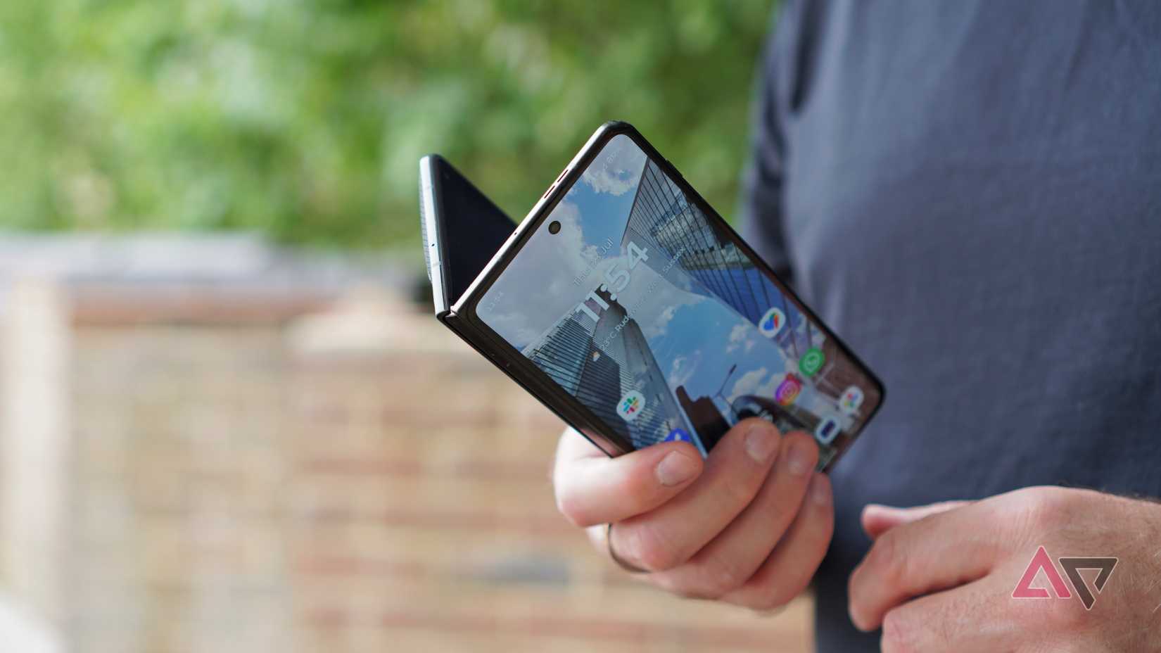 A person closing the Motorola Razr Fold