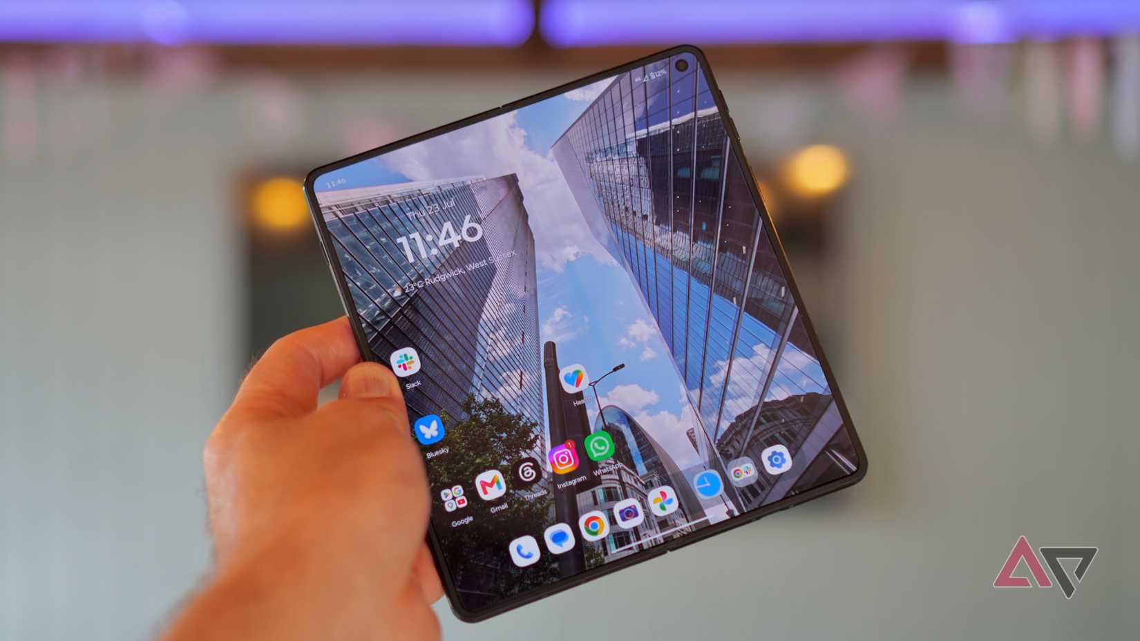 A person holding the open Motorola Razr Fold