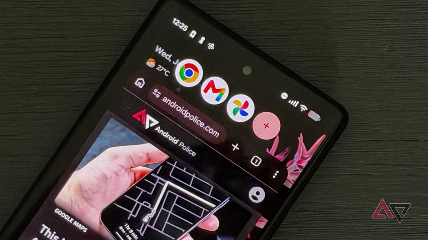 A Google Pixel 6 laying on a table showing app bubbles in Android 17.
