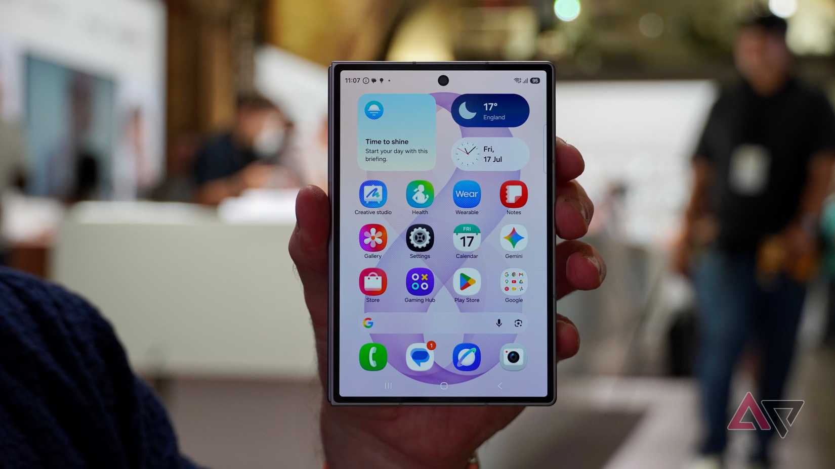 A person holding the closed Samsung Galaxy Z Fold 8