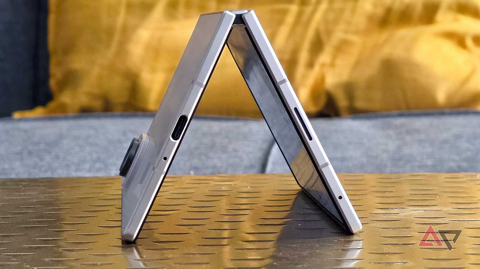 The Samsung Galaxy S26 bent on a metal table.