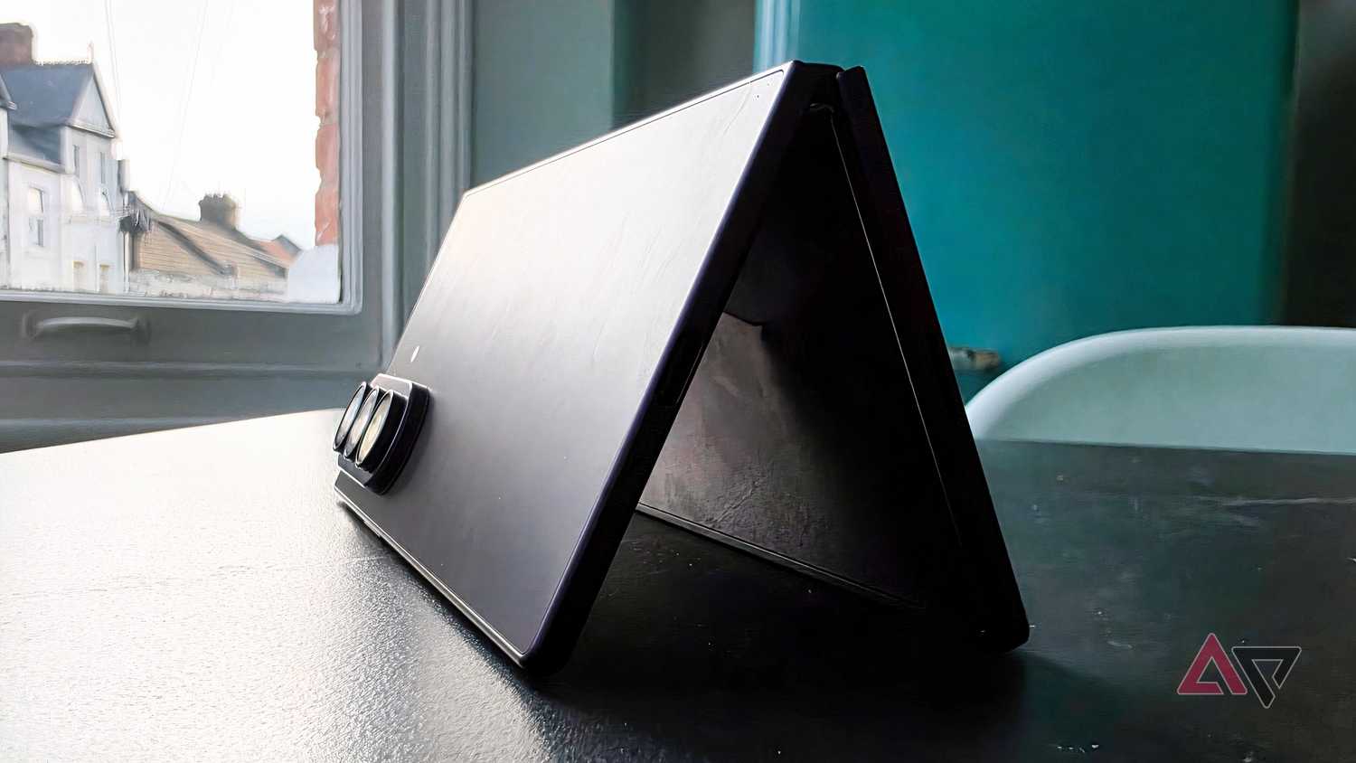 The Samsung Galaxy Z Fold 8 Ultra on a table, half unfolded.