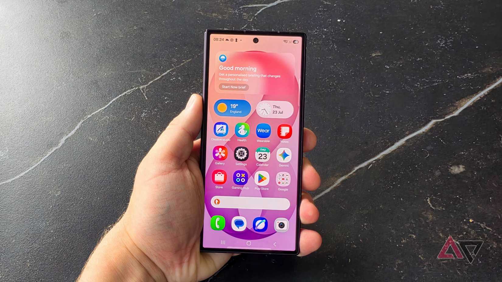 The Samsung Galaxy Z Fold 8 Ultra in a man's hand, showing its outer display.