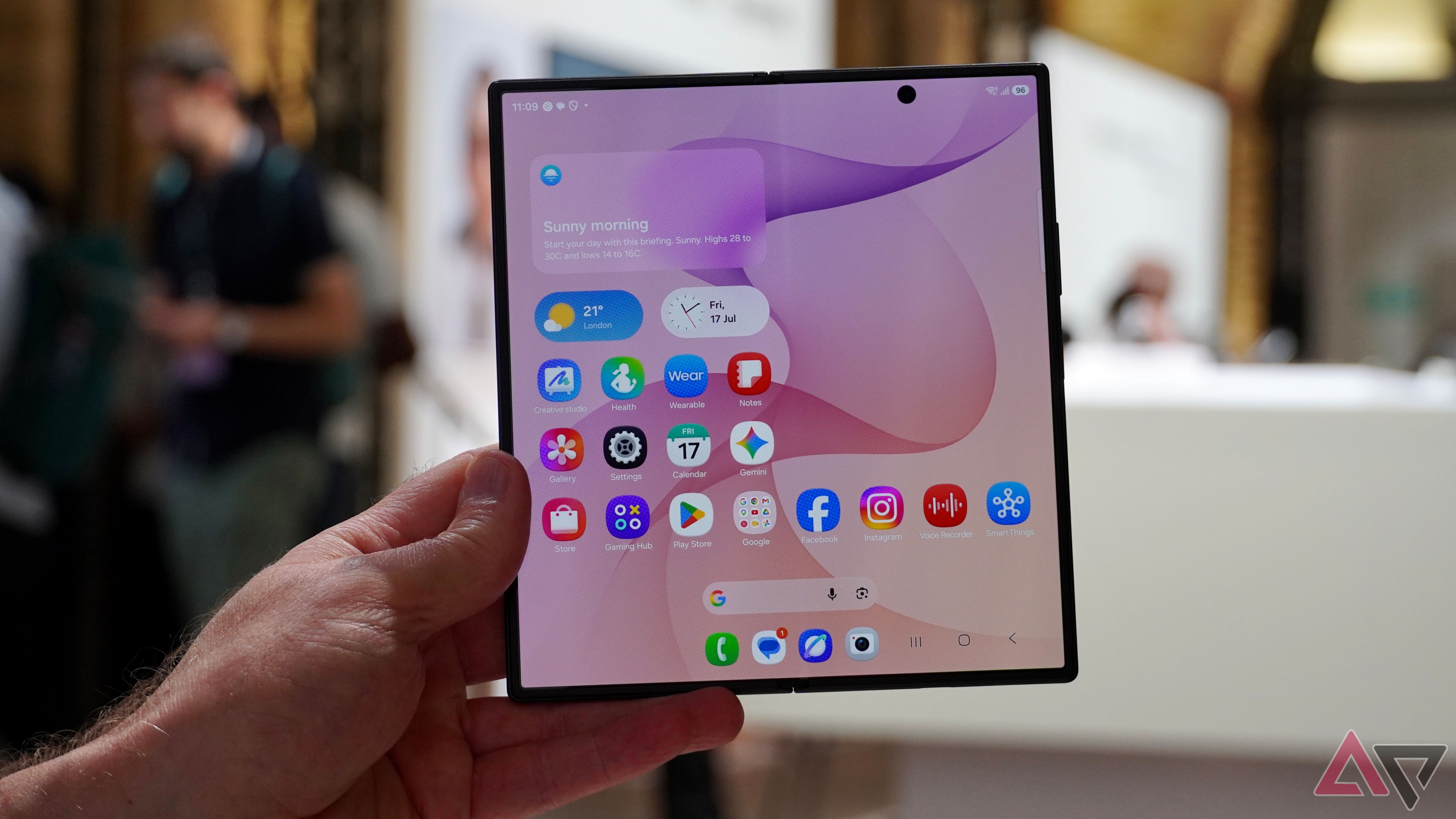 A person holding the open Samsung Galaxy Z Fold 8 Ultra