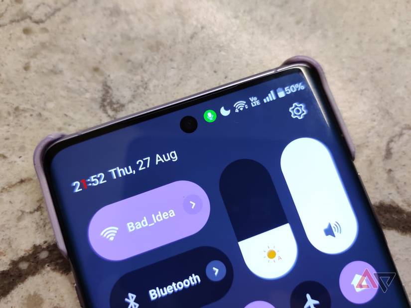 The green microphone icon on a phone screen