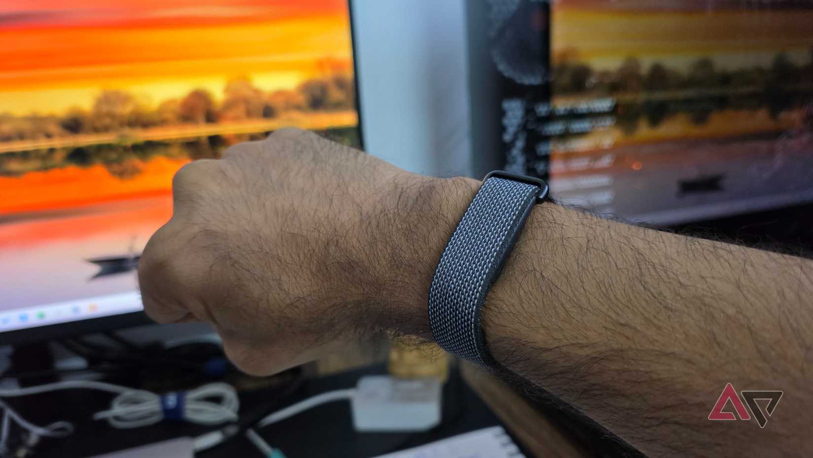 A snapshot of a person wearing Fitbit Air