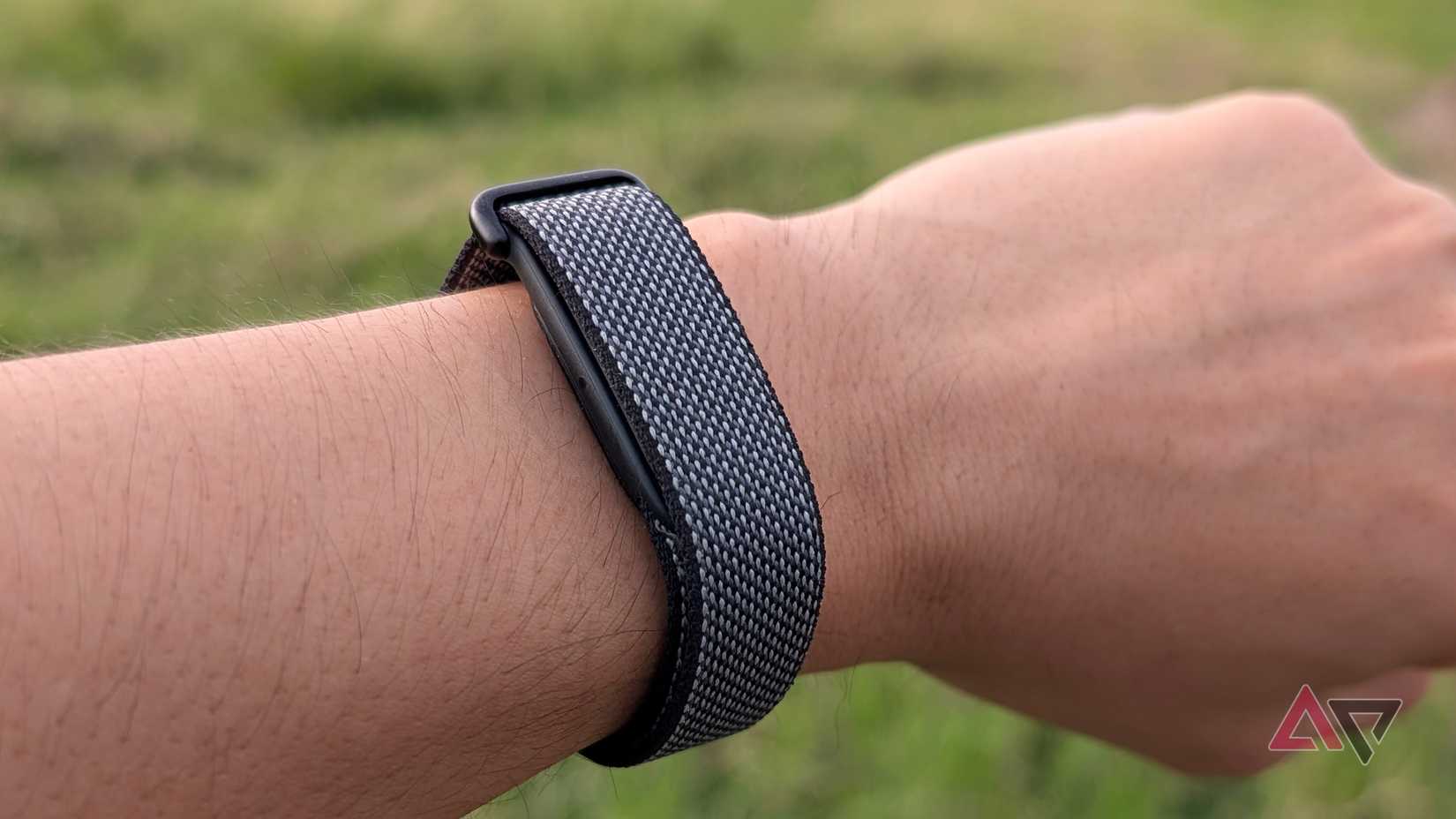 Google Fitbit Air obsidian on a gray fabric strap