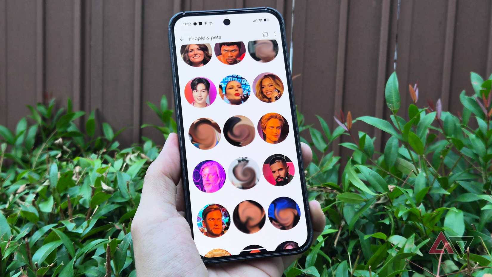 A Google Pixel phone showing the face groups section in Google Photos app