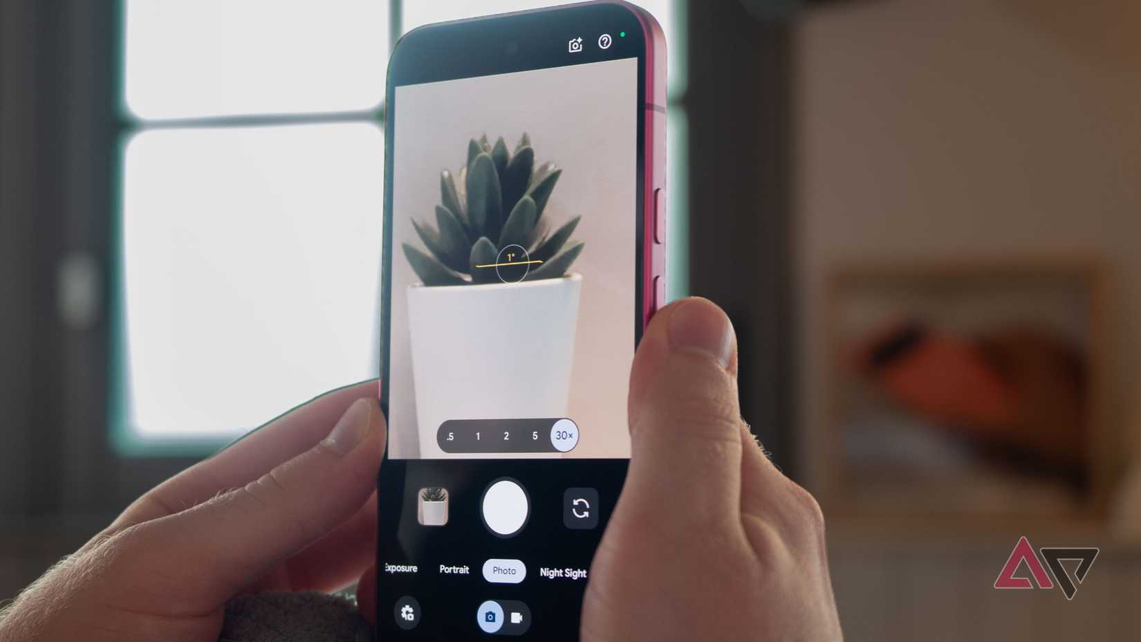 Google Pixel 11 in hand, showing the Camera's new 30x zoom