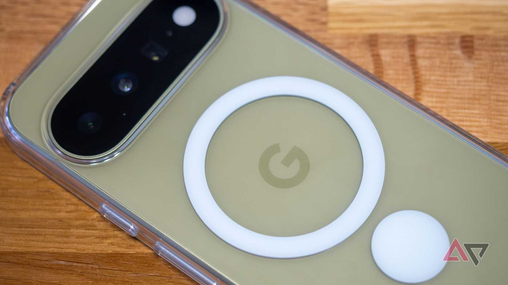 Google Pixel 11 on table, pistachio color, in Pixelsnap case