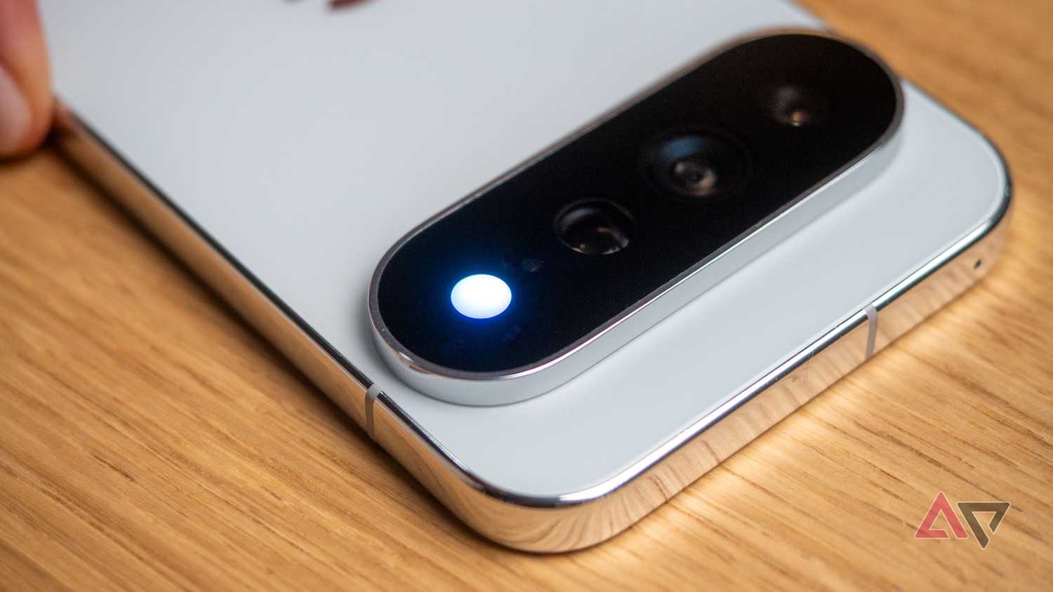 Google Pixel 11 Pro XL in Fog color showing Hi-Light blue contact notification light