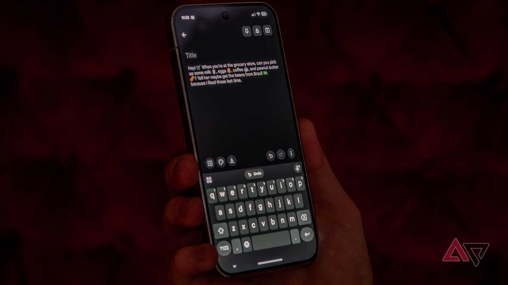 Google Pixel 11 Pro XL in hand with Gboard Ramble's transcription with emoji