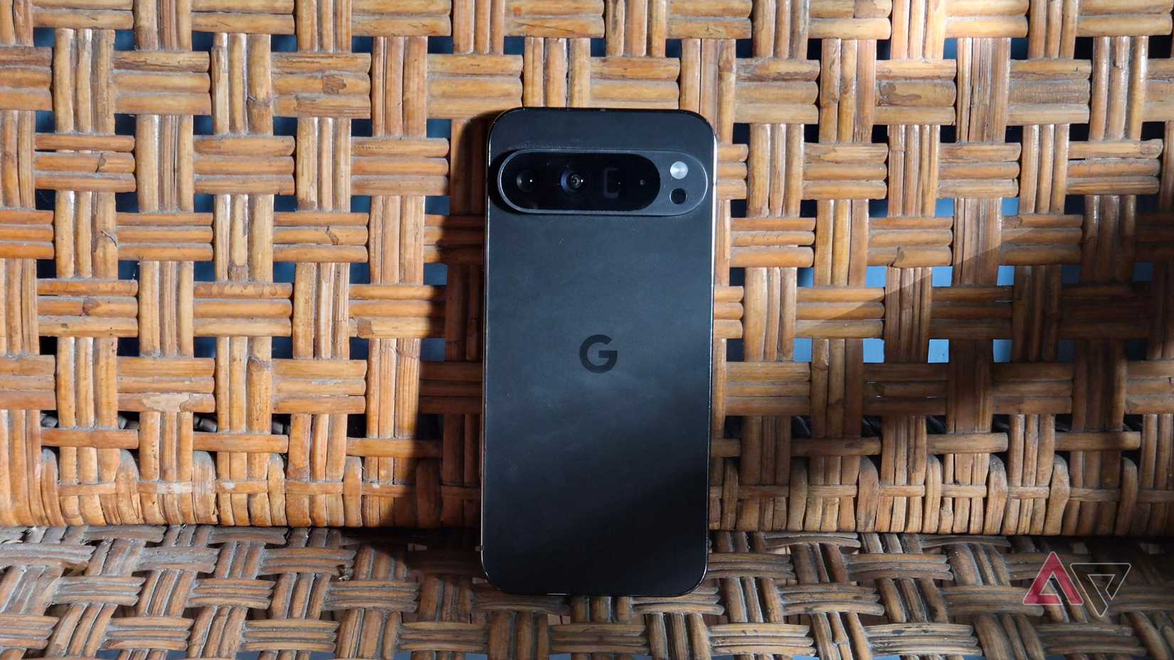 Google Pixel 9 Pro XL in obsidian color on woven bench
