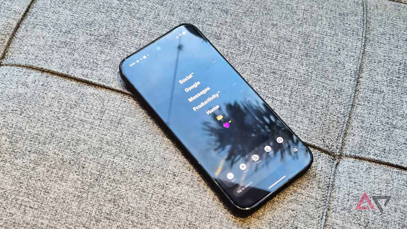 A Google Pixel phone on a couch using the Ratio launcher
