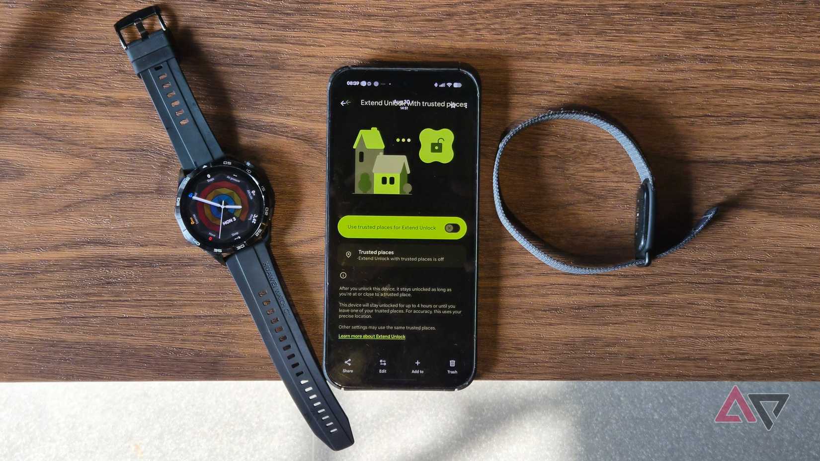 Google Pixel phone with Huawei watch and Fitbit Air tracker on a table