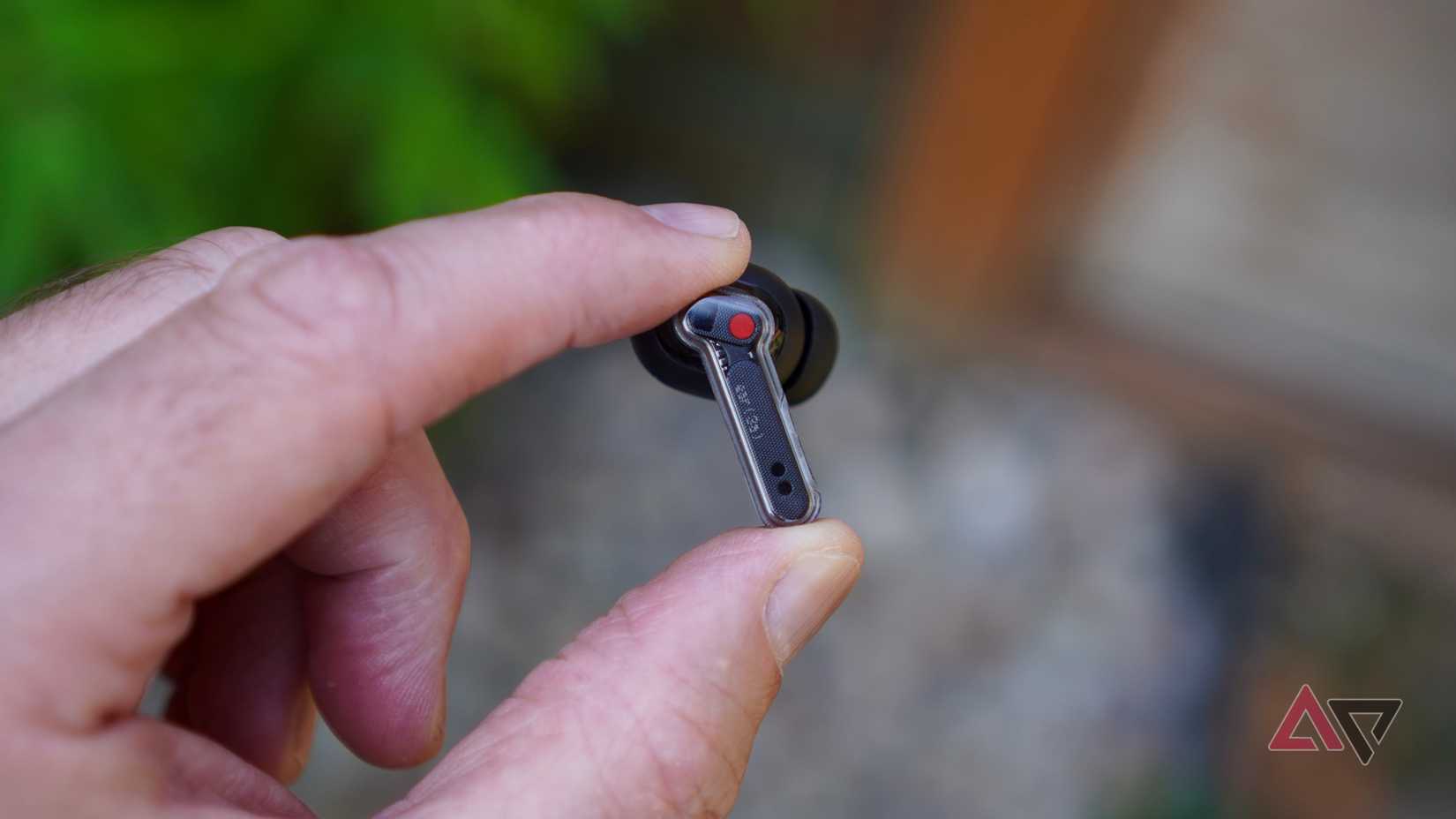A person holding the Nothing Ear (3a)