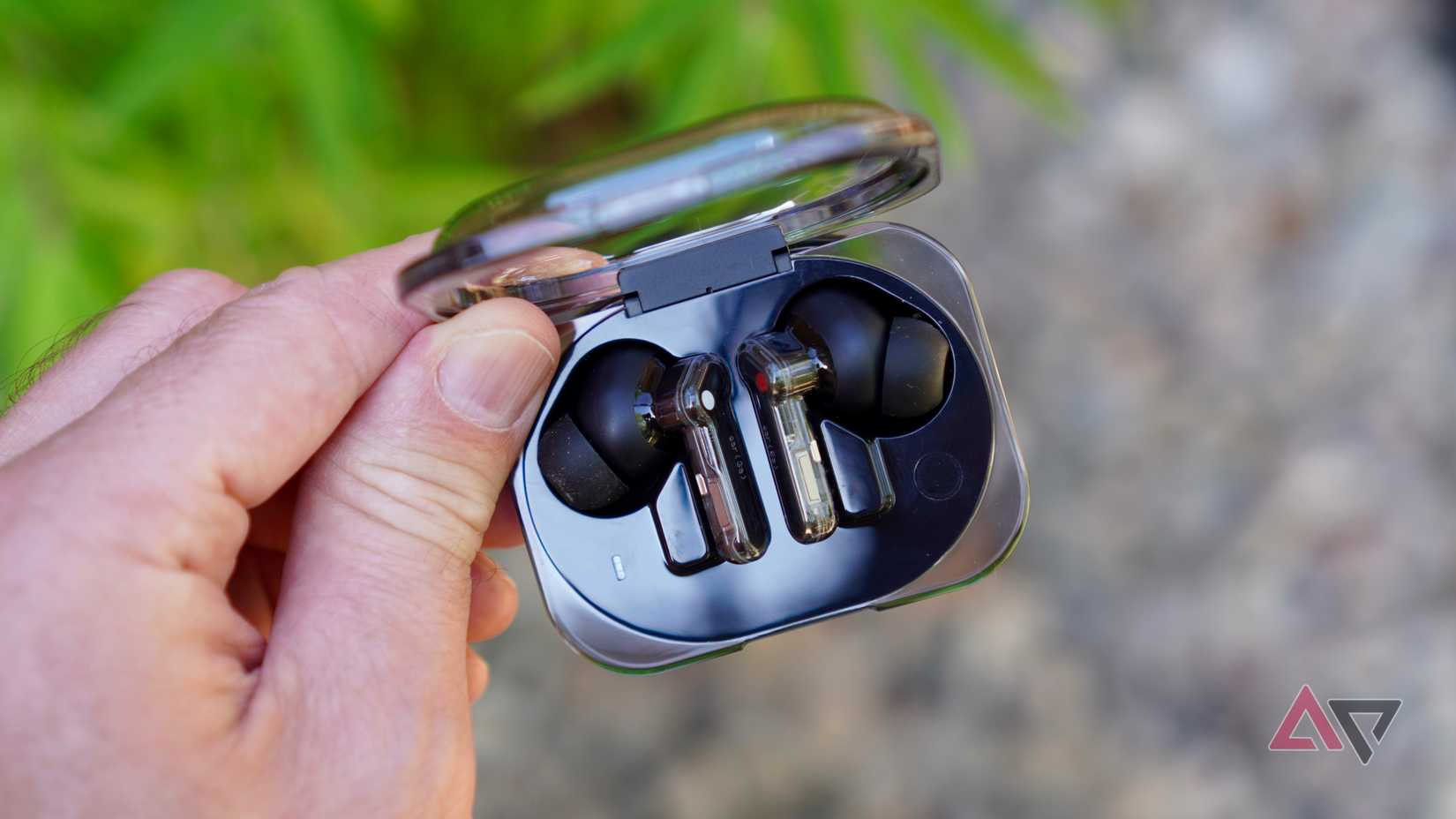 A person holding the Nothing Ear (3a)
