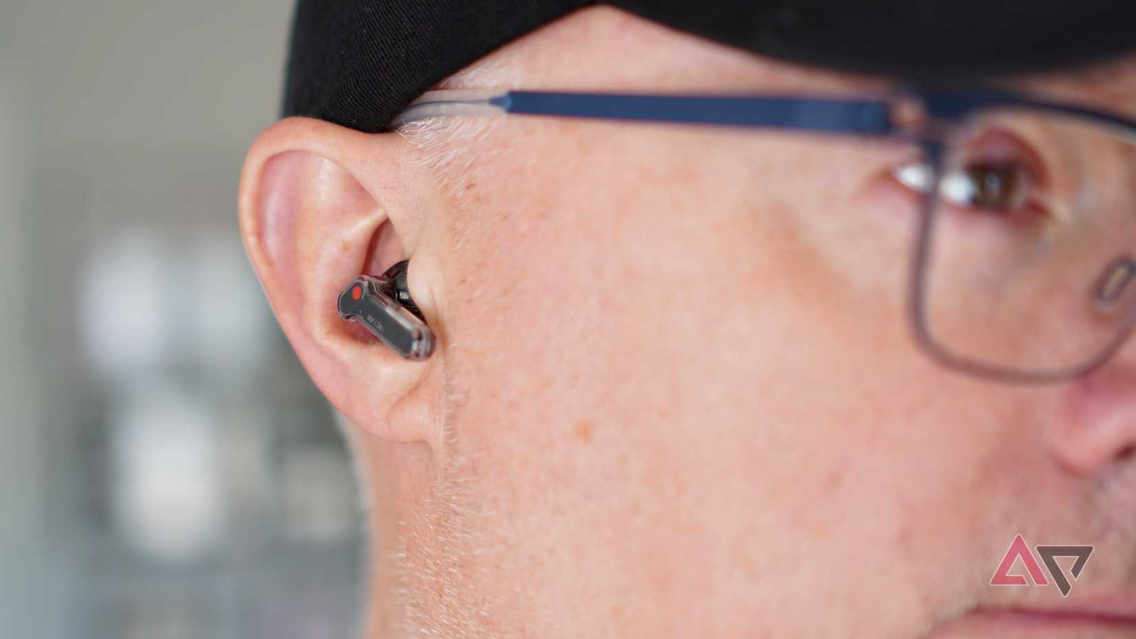 A person using the Nothing Ear (3a)