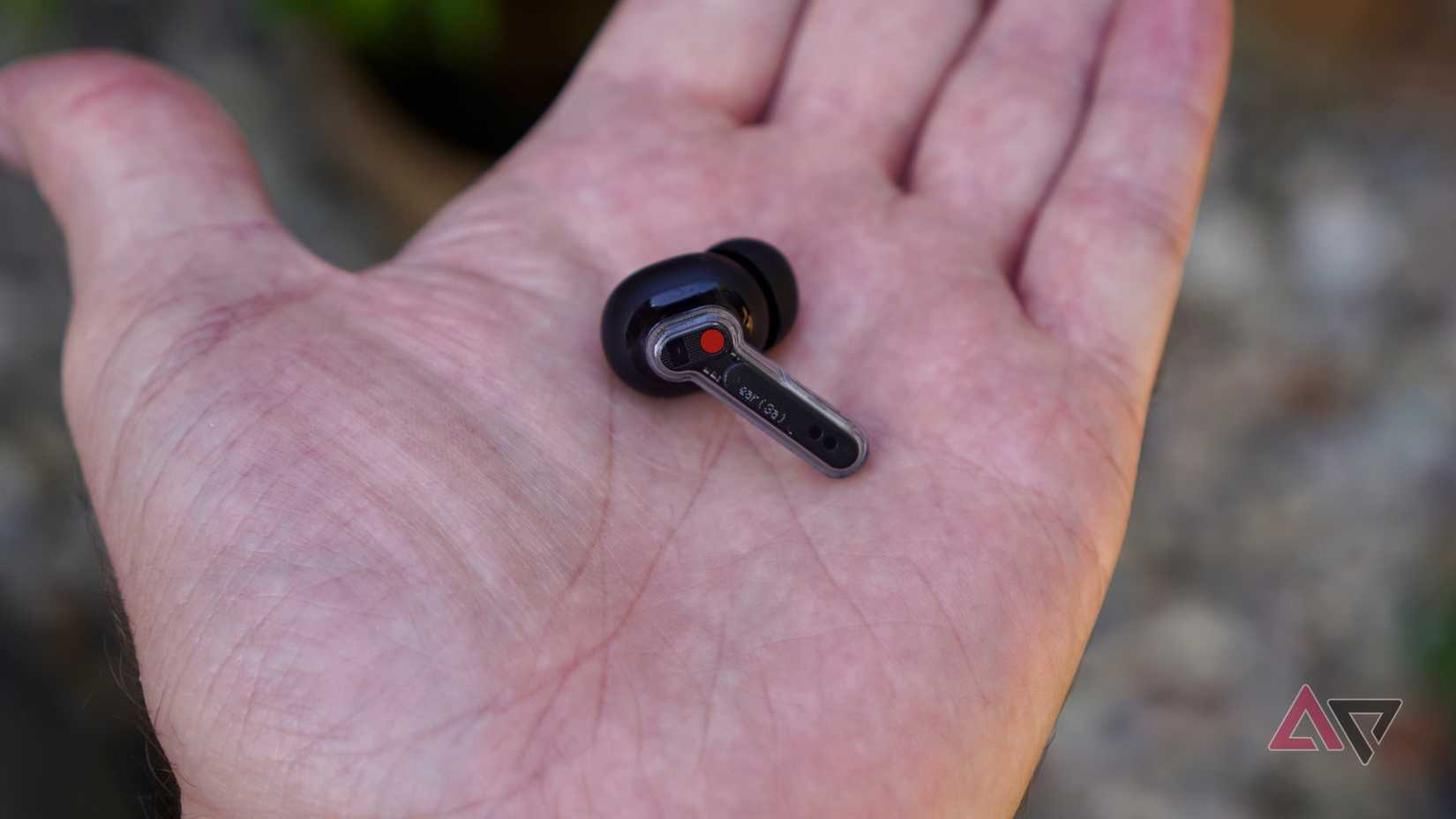 A person holding the Nothing Ear (3a)