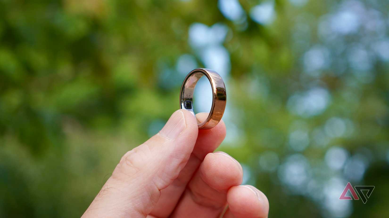 A person holding the Oura Ring 5