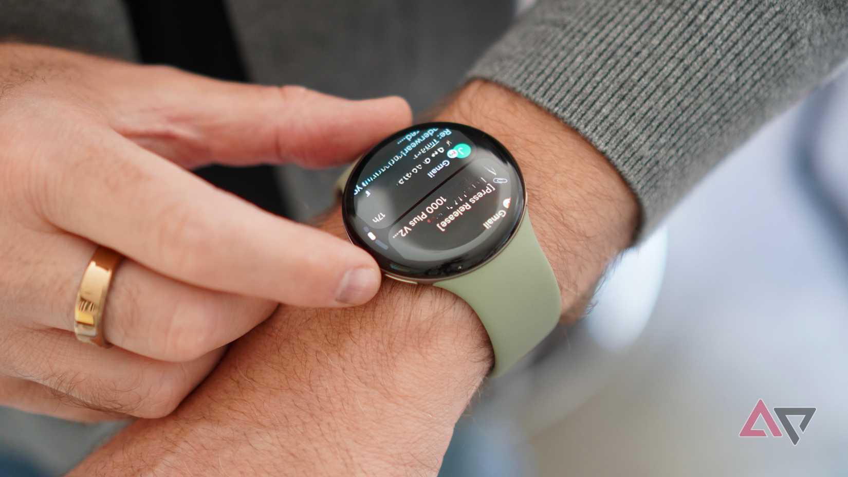 A person wearing the Google Pixel Watch 5 showing notifications