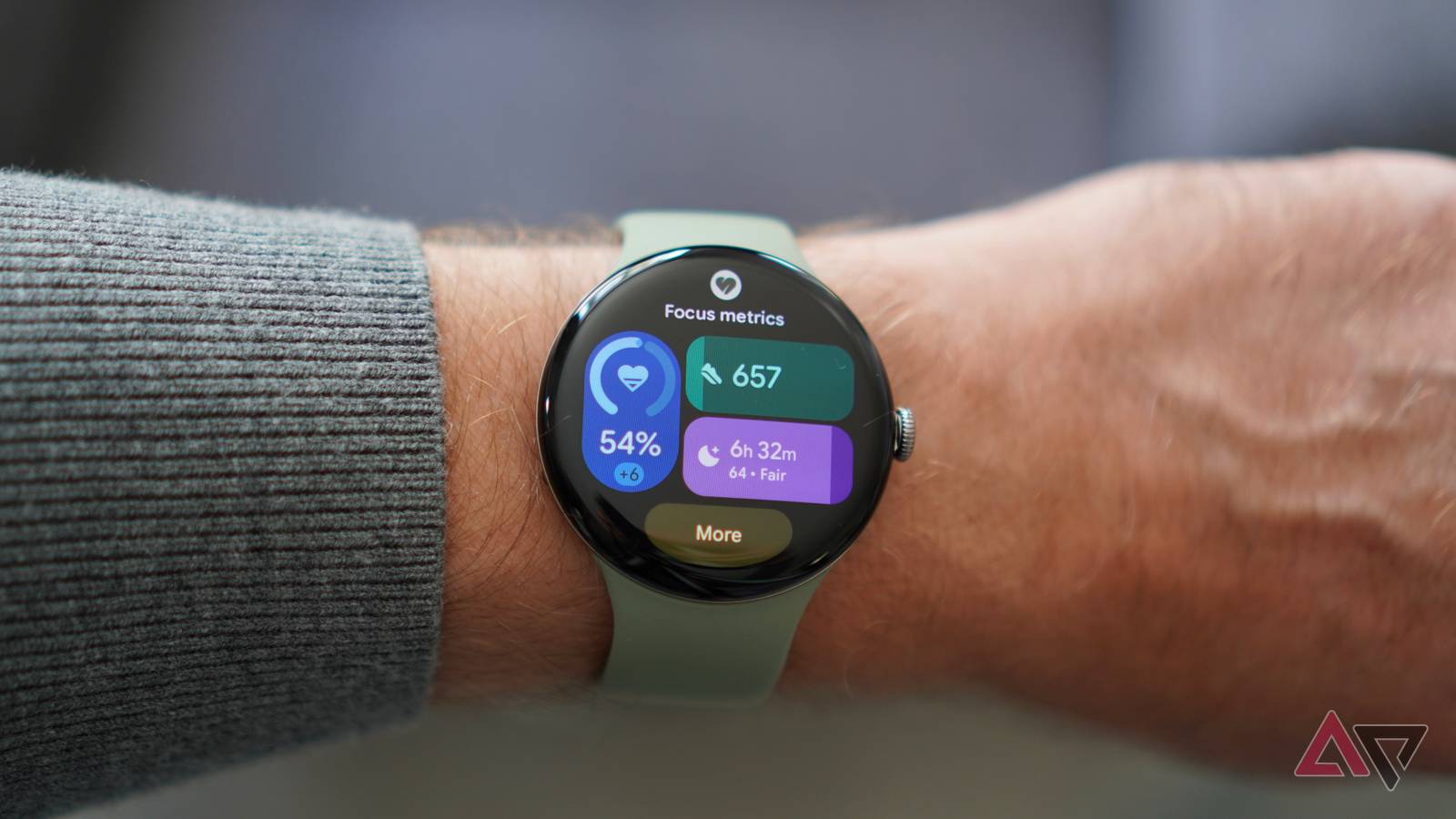 A person wearing the Google Pixel Watch 5 showing the Focus tile