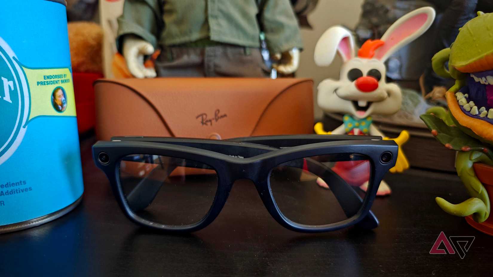 The ray ban meta glasses next to some funko pops