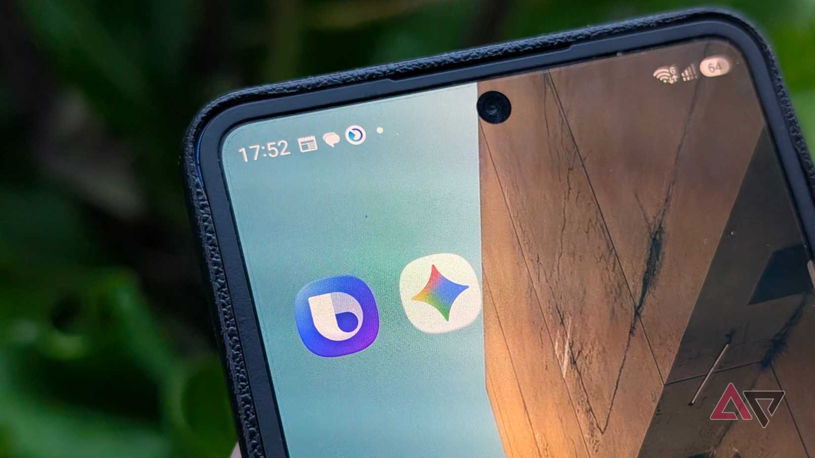Samsung Galaxy Z Flip 7 phone with Bixby and Gemini AI chatbot apps on the home screen and showing status and notifications bar