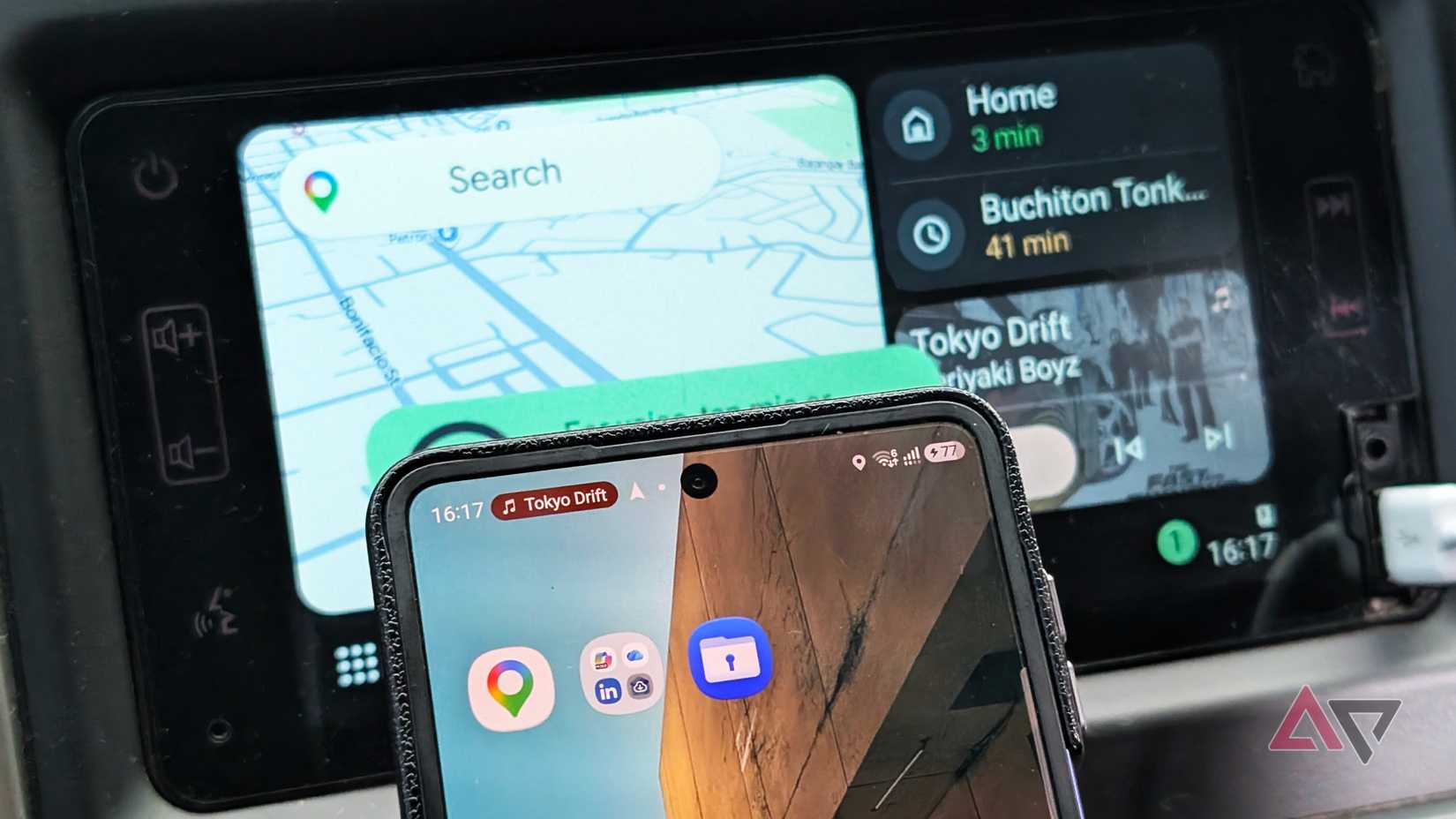 Samsung Galaxy Z Flip phone with Google Maps apps and an Android Auto display