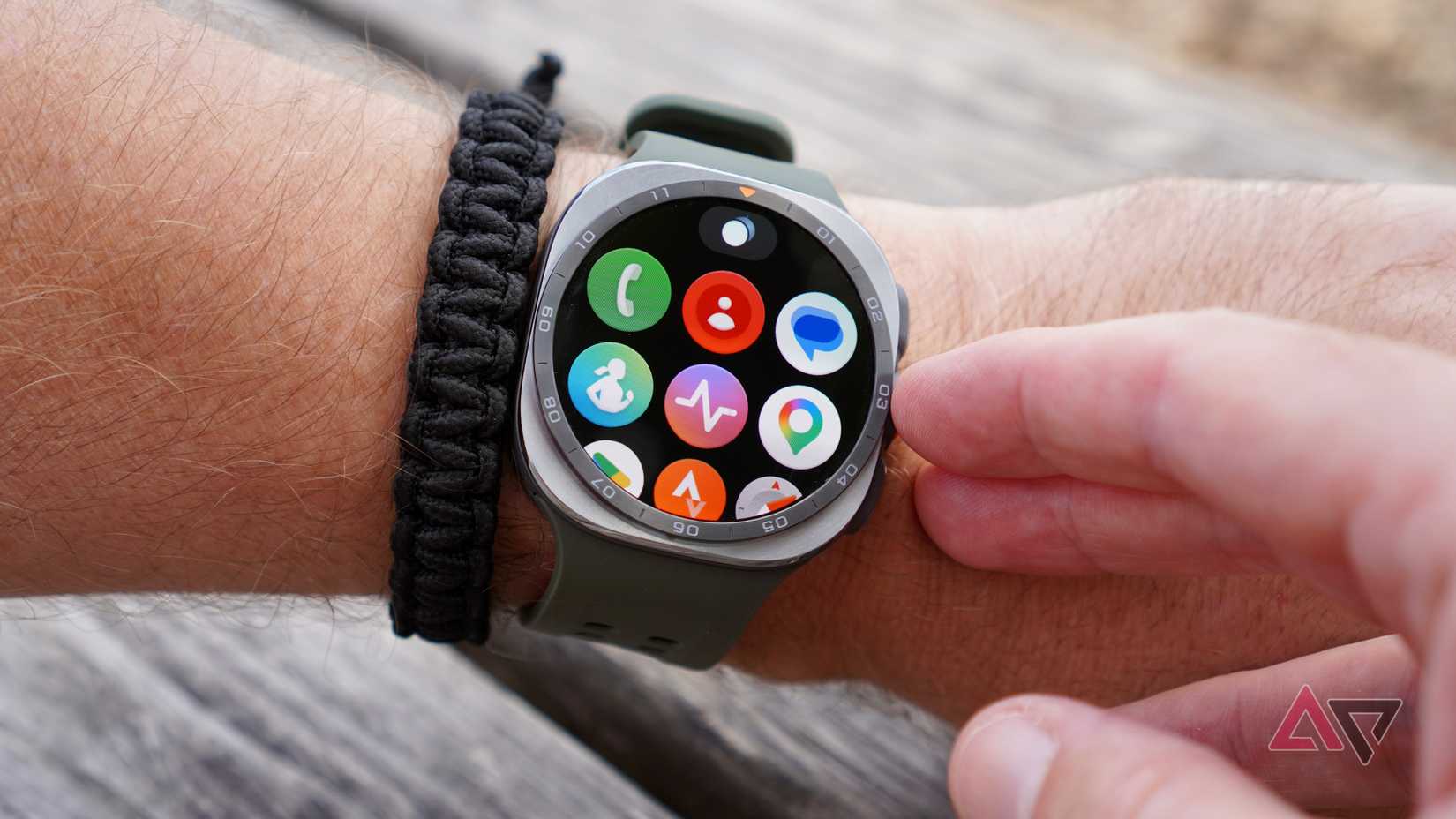 A person wearing the Samsung Galaxy Watch Ultra 2 showing the apps