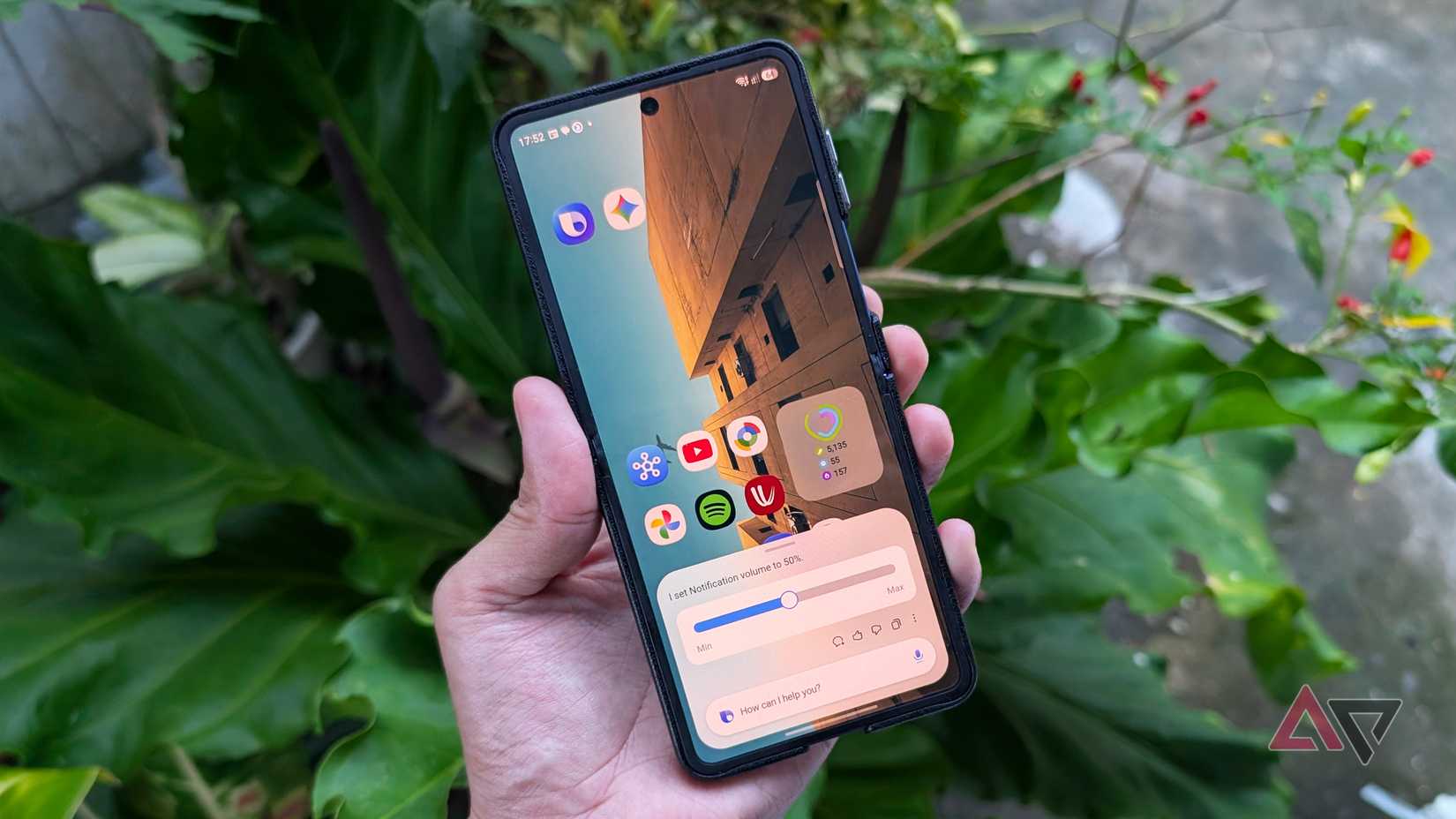 Samsung Galaxy Z Flip 7 smartphone with Bixby and Gemini on its homescreen along with Google apps