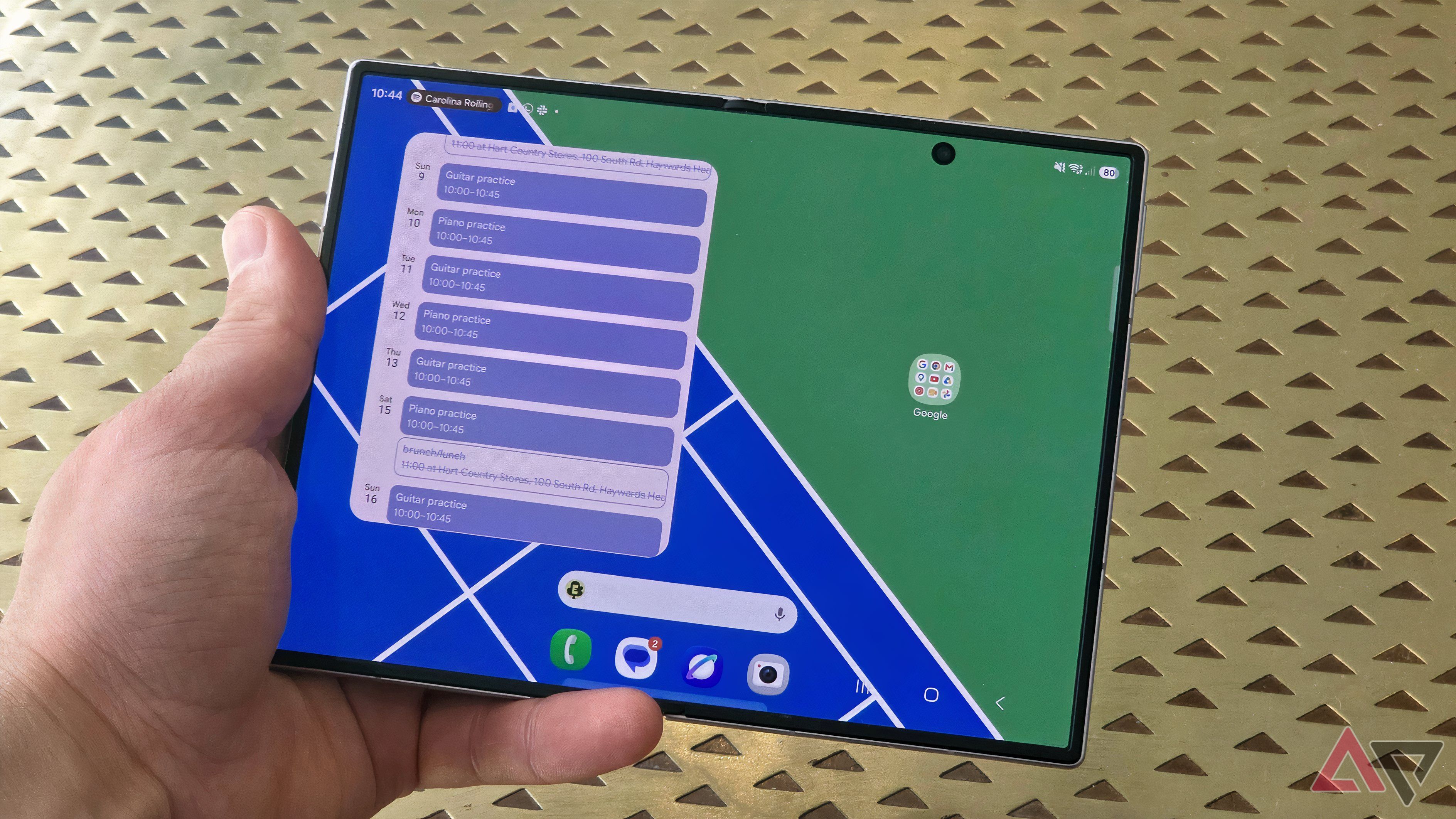 The Samsung Galaxy Z Fold 8 showing a large Calendar schedule widget on half of its wide display.
