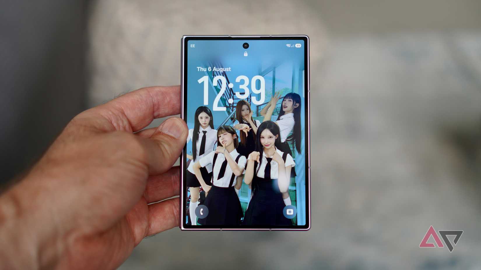 A person holding the closed Samsung Galaxy Z Fold 8