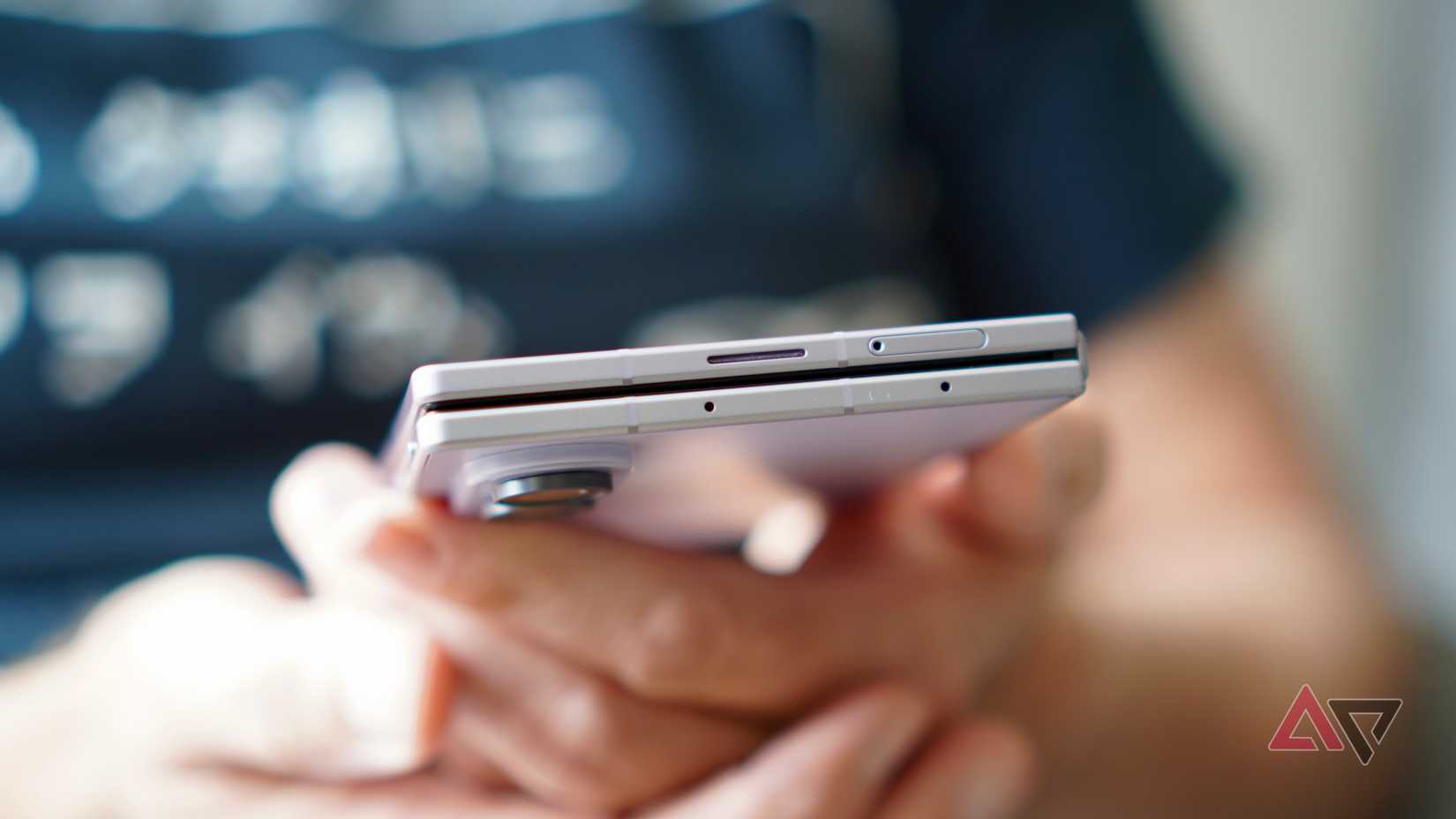 A person holding the closed Samsung Galaxy Z Fold 8