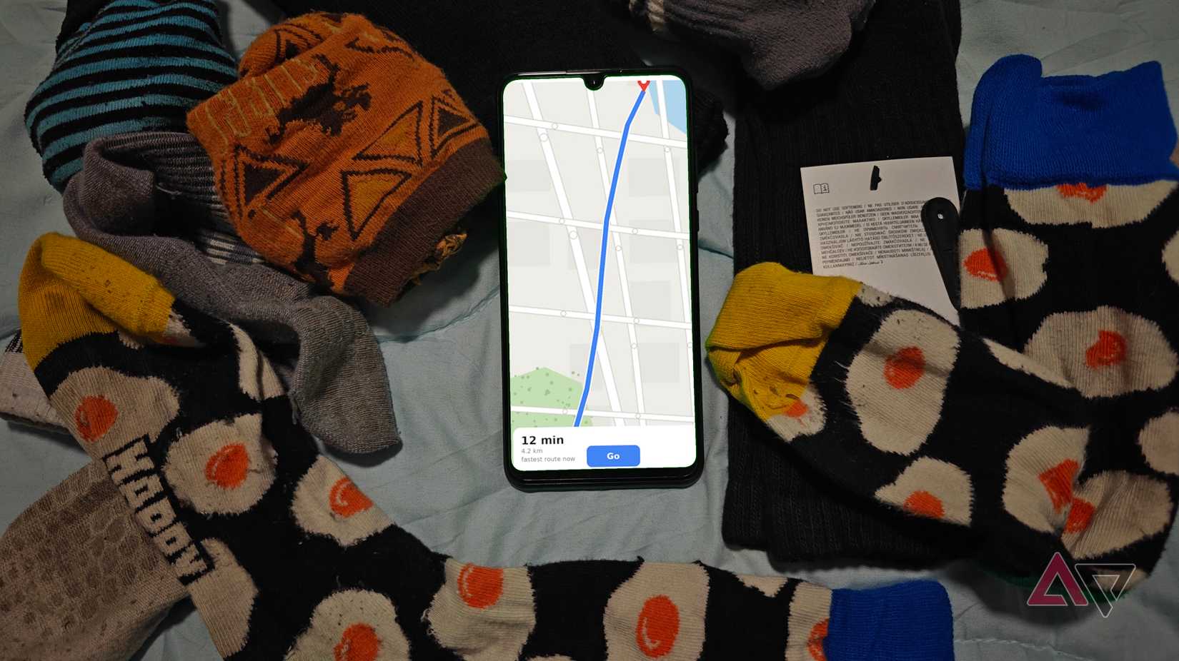 A phone with a map around some socks