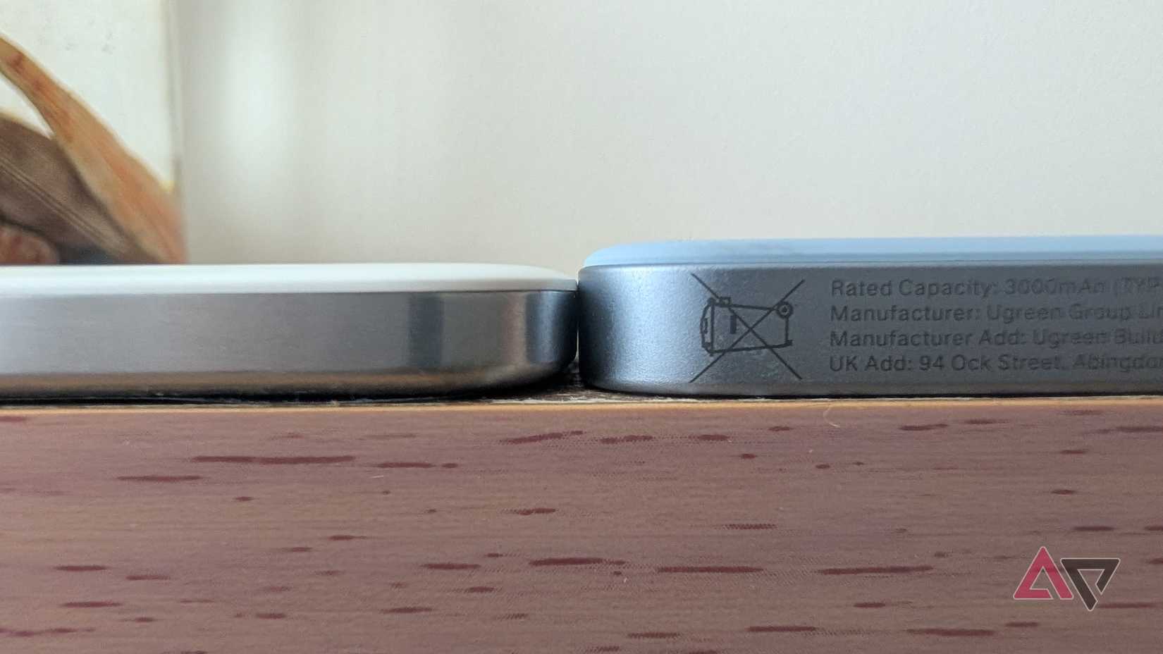 two silver power banks lying flat next to each other