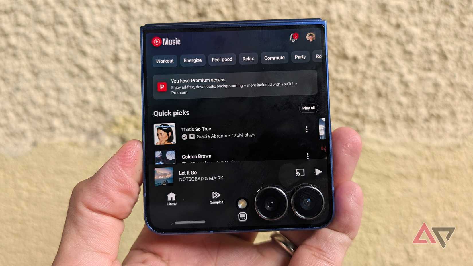 Samsung Galaxy Z Flip 7 smartphone with YouTube Music running