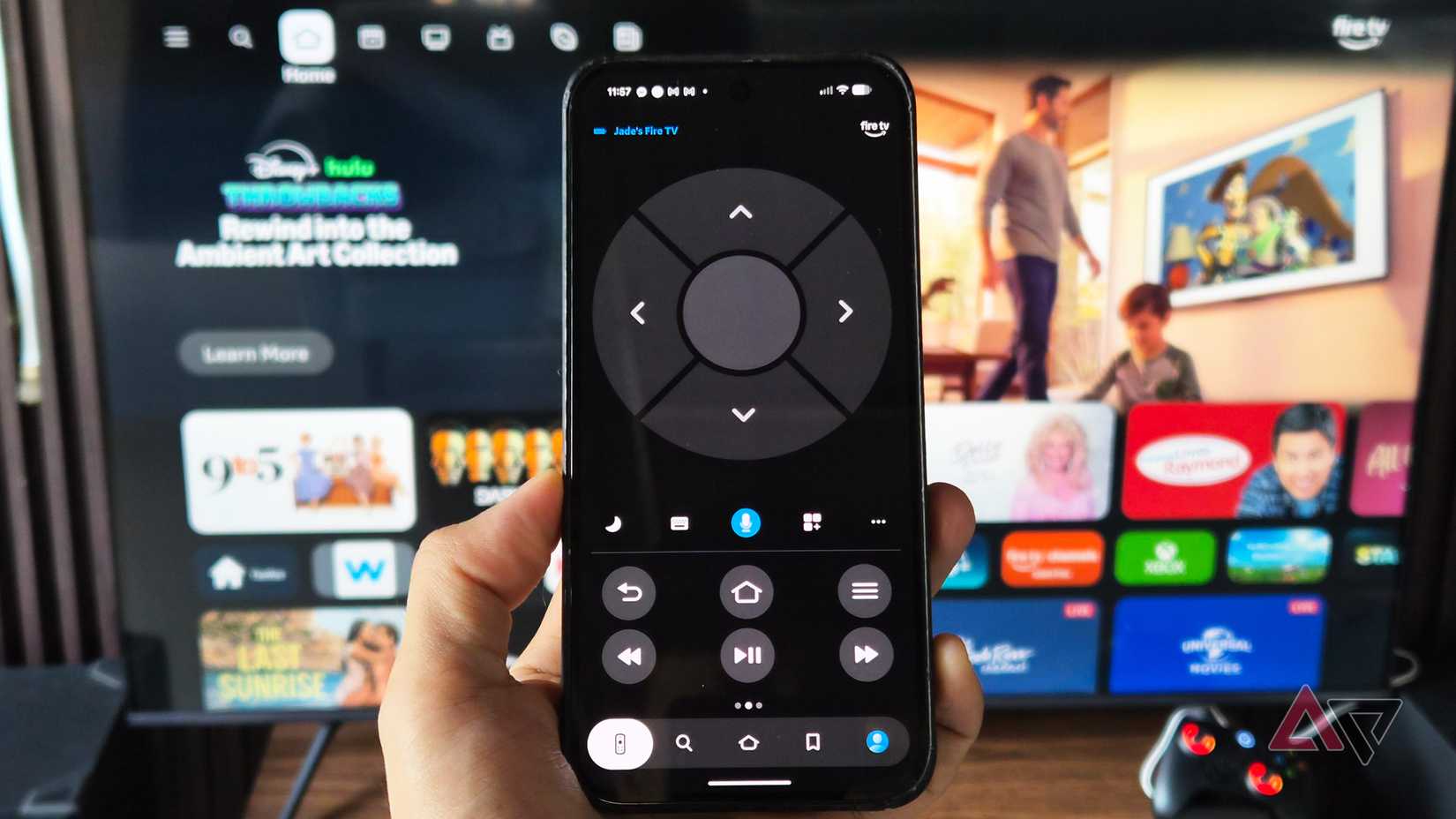 Google Pixel phone with Amazon Fire TV app installed and a smart television behind