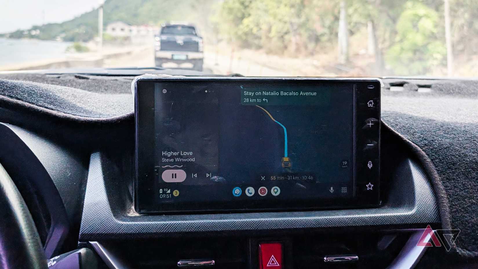Android Auto on a Toyota vehicle center display with Waze, YouTube Music, and Google Maps