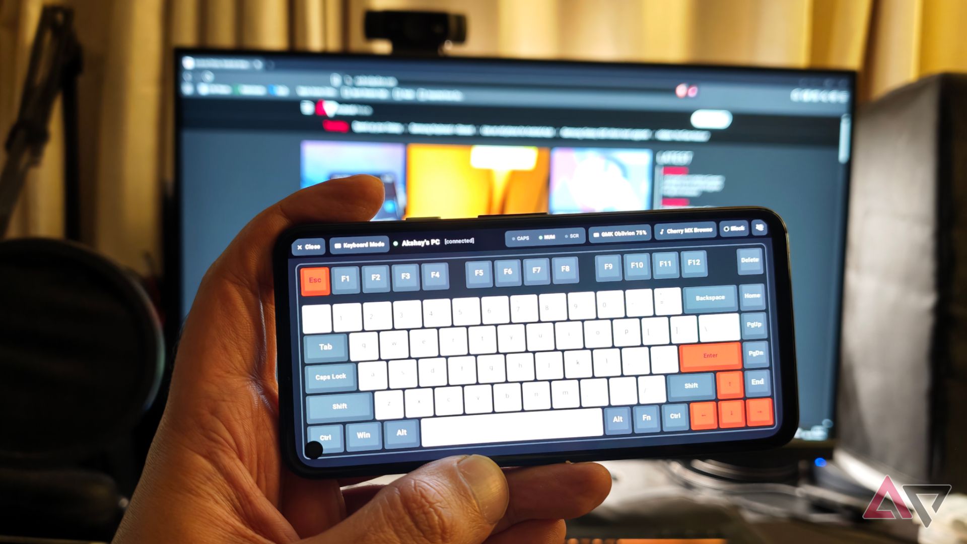 Bluke app running on a GMK oblivion keyword on the Pixel 4a with a PC in the background