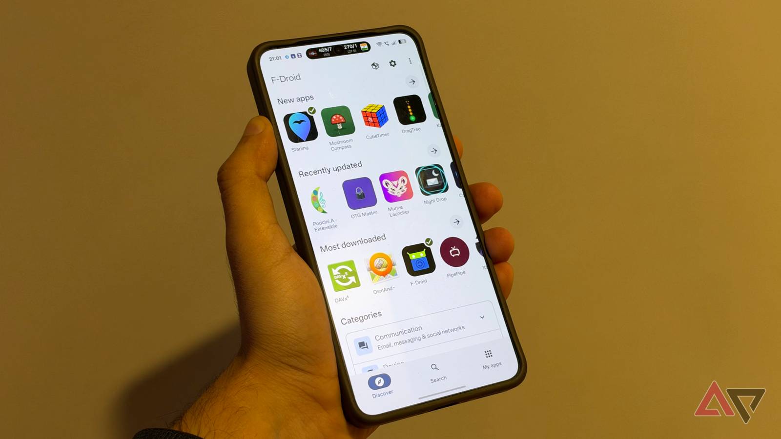 F-Droid 2.0 home page on phone in hand