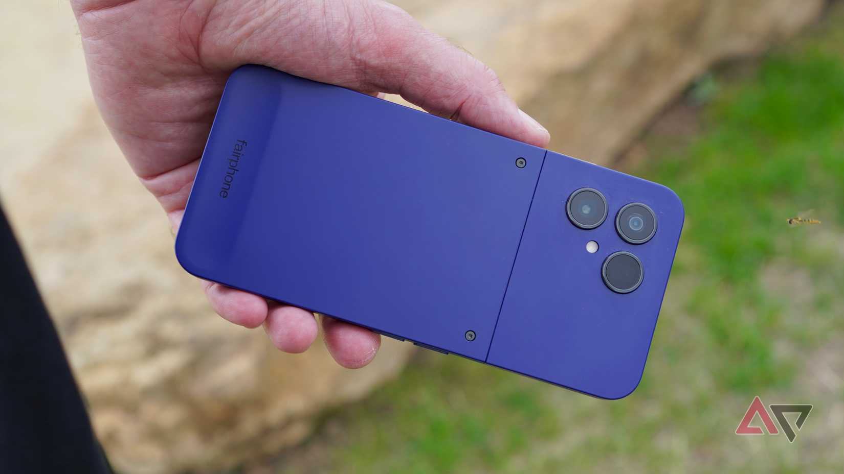 A person holding the Fairphone Gen 6 Plus