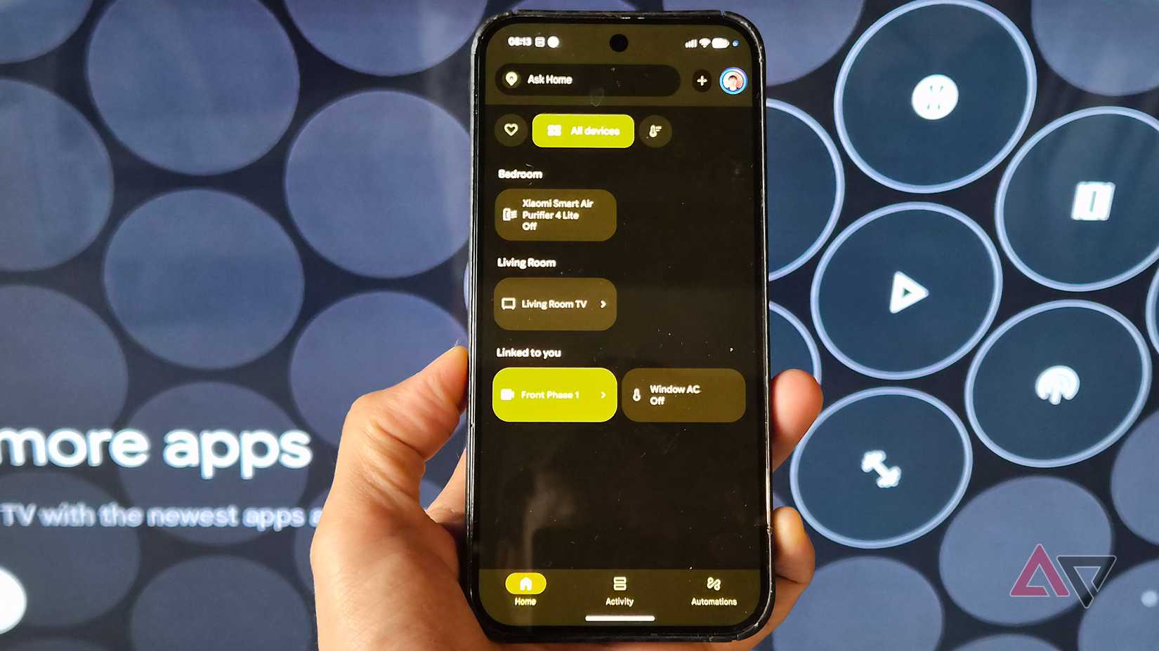 Google-Pixel-phone-showing-smart-Home-app-with-a-Google-TV-streamer-interface-on-the-background-1